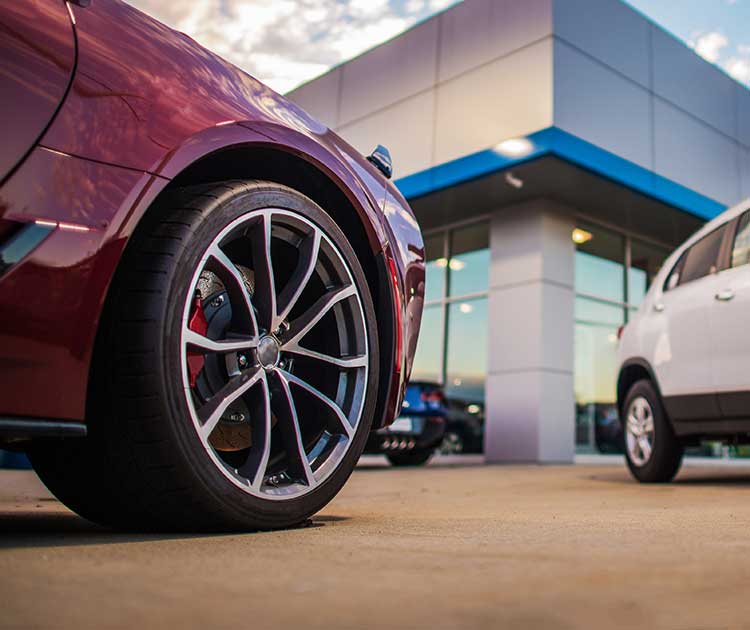 Photo of cars at a dealership lot.