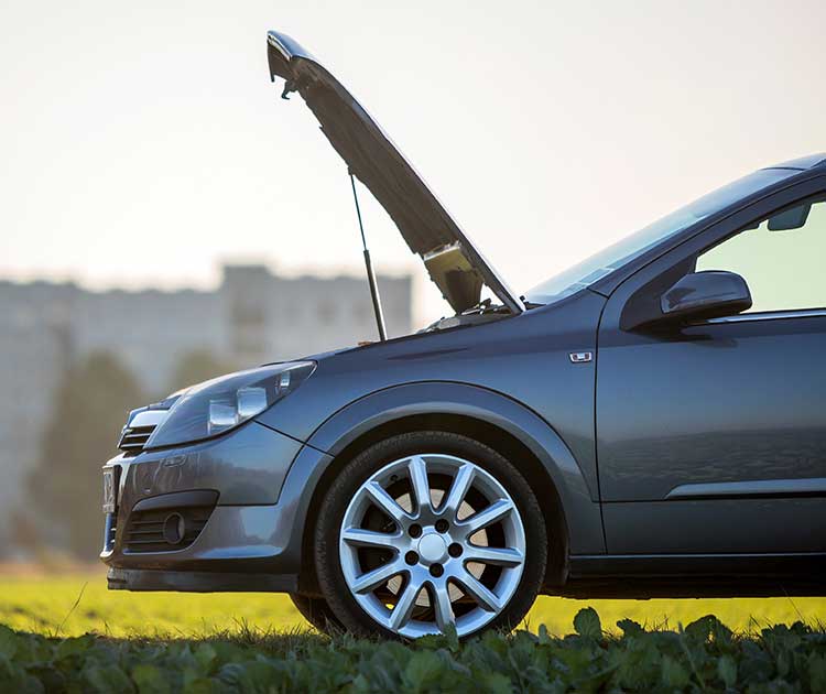 A side photo of a car with the hood open.