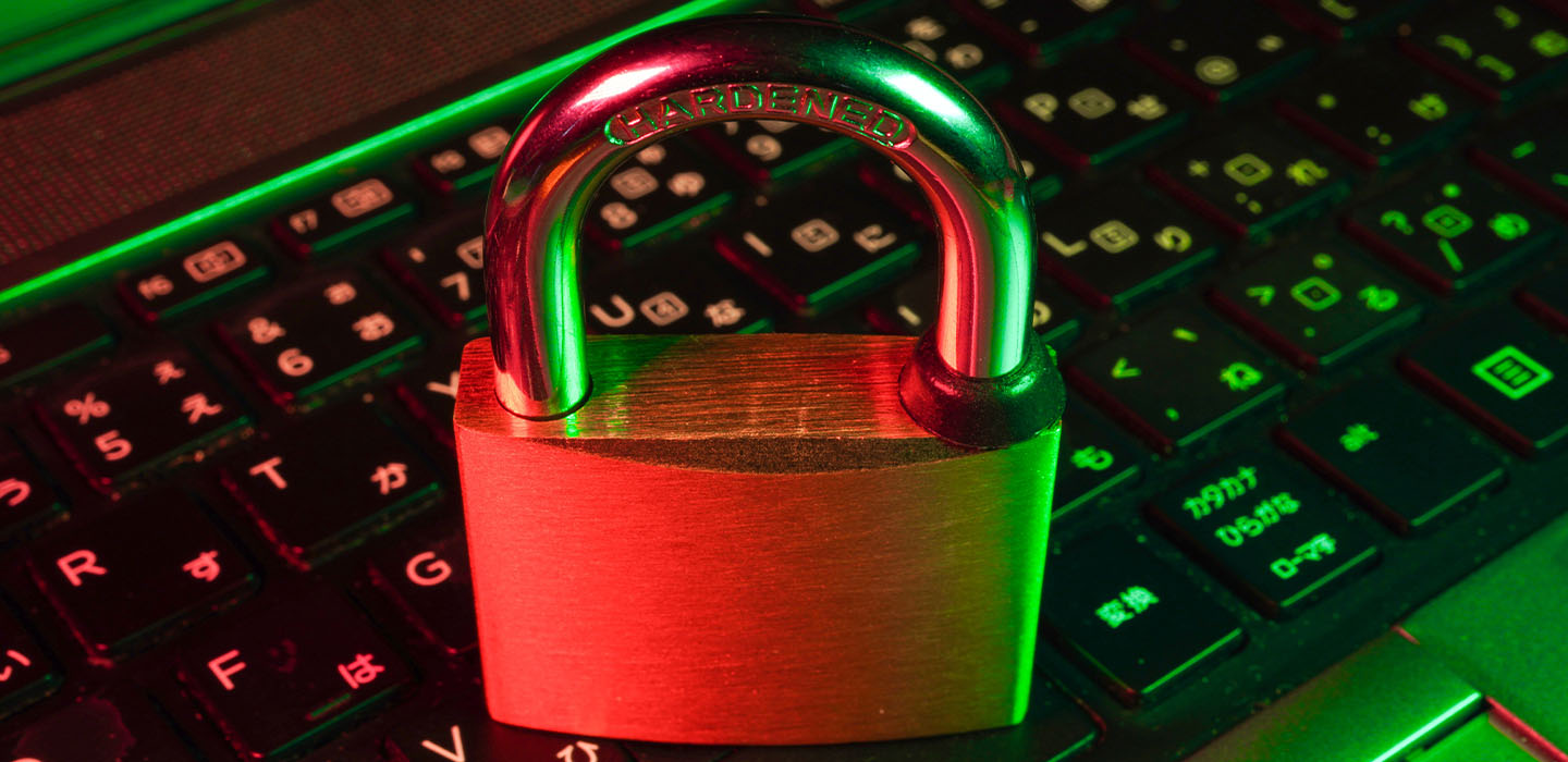 A padlock on top of computer keyboard.