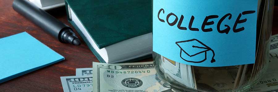 A money jar label "College" on a table with loose dollars and financial documents.