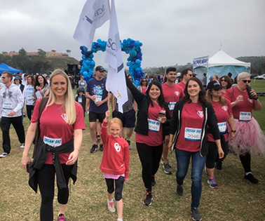 Group photo of employees at a race